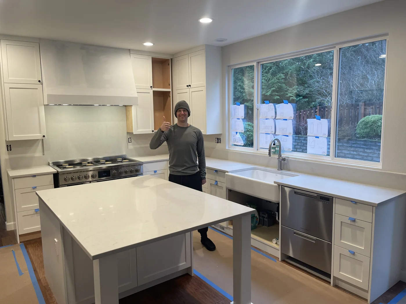 Homeowner giving a thumbs-up beside their finished Top Granite countertop
