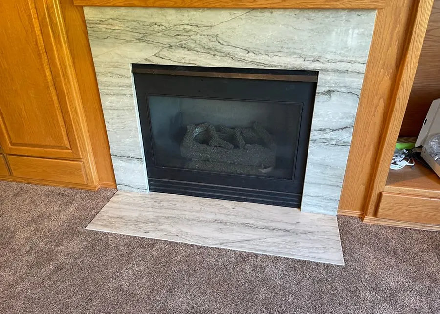Stone fireplace surround. A Top Granite project