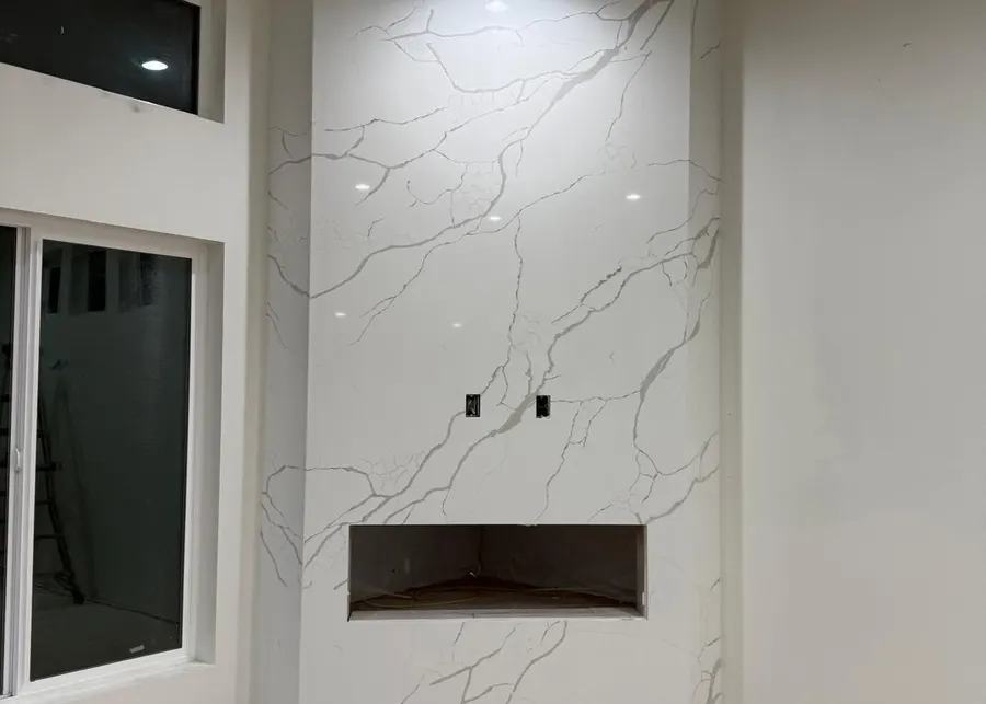 Full-height slab shower walls and vanities. A Top Granite project