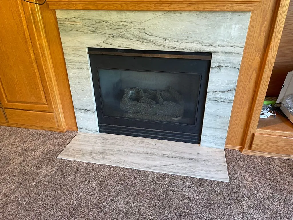 Stone fireplace surround and hearth, a Top Granite remnant project