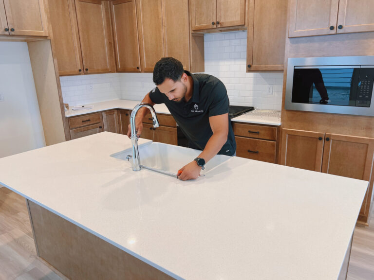 A man carefully measuring new countertops with a tape measure to ensure a precise fit in a kitchen